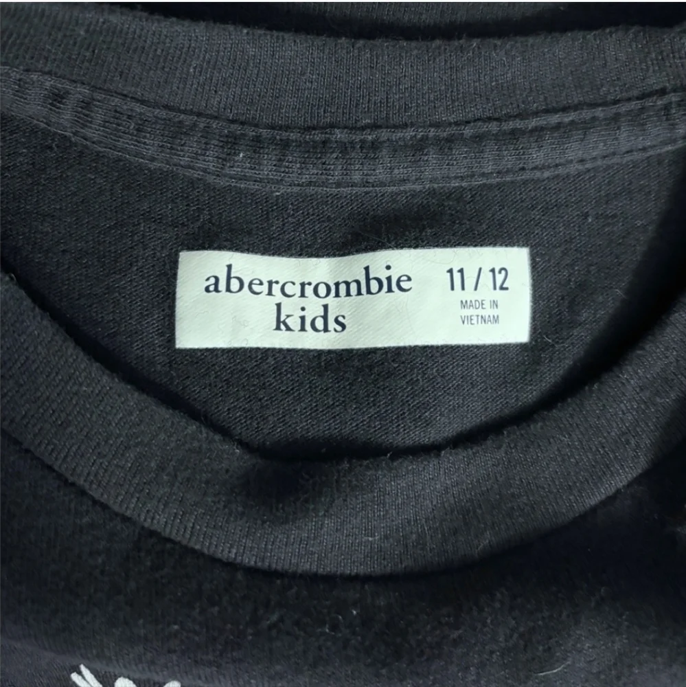 ABERCROMBIE KIDS Black Crew Neck Long Sleeve Graphic Shirt “The Child”